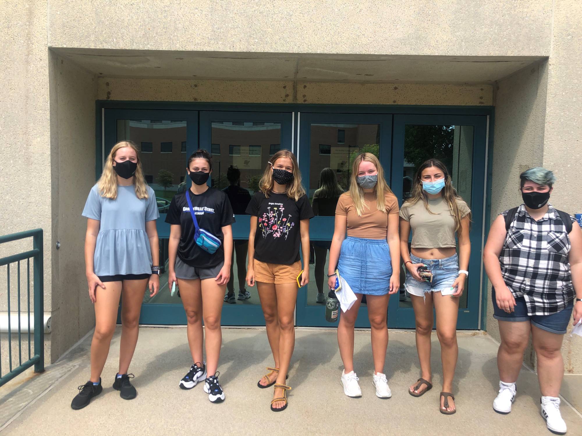 Mentor group standing with masks on